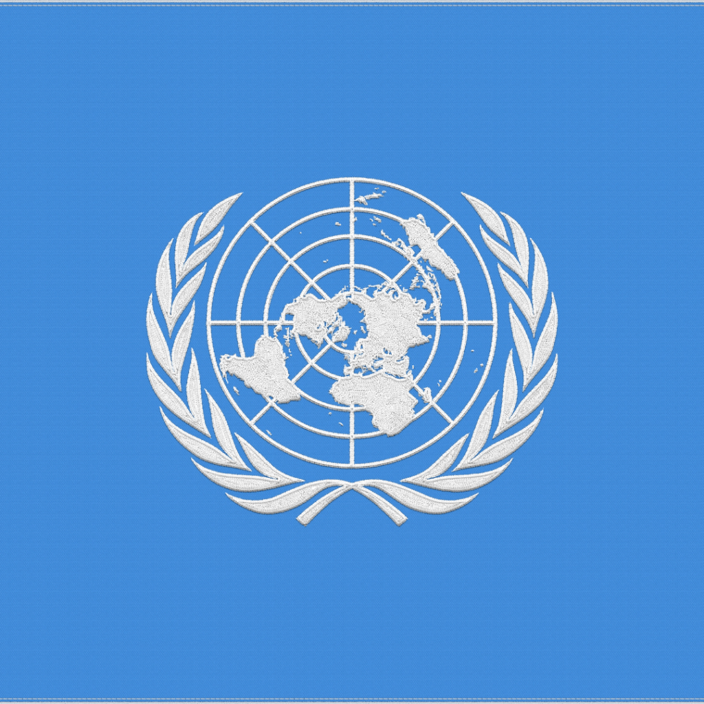 United Nations Logo against UN Blue background